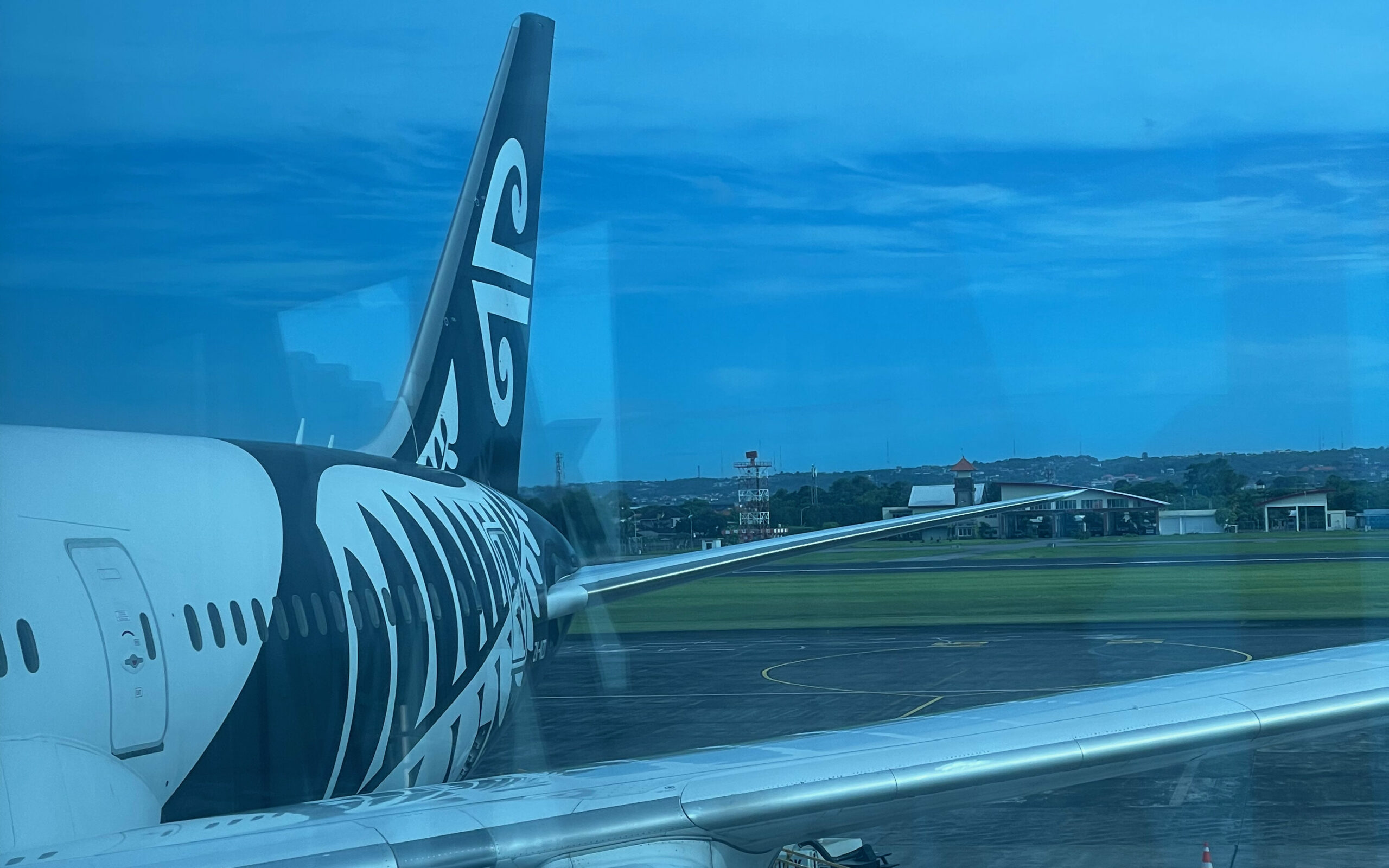 Air New Zealand tail fin of a parked aircraft.